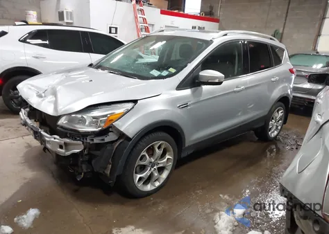 2016 Ford Escape Titanium z USA, uszkodzony, nr VIN 1FMCU9J97GUC36498
